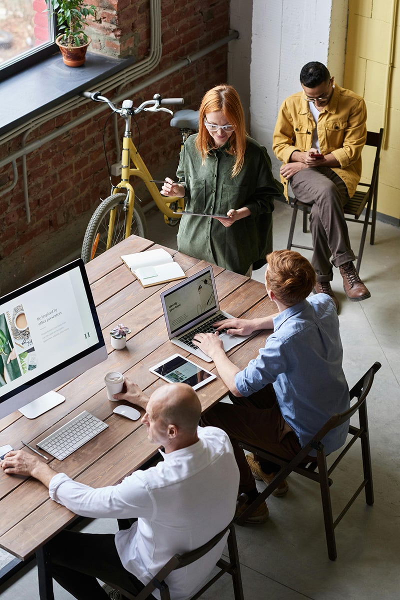 employees collaborating in shared workspace 